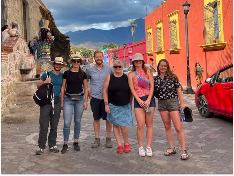 Diverse group of tourists on authentic Oaxaca walking tour with local guide